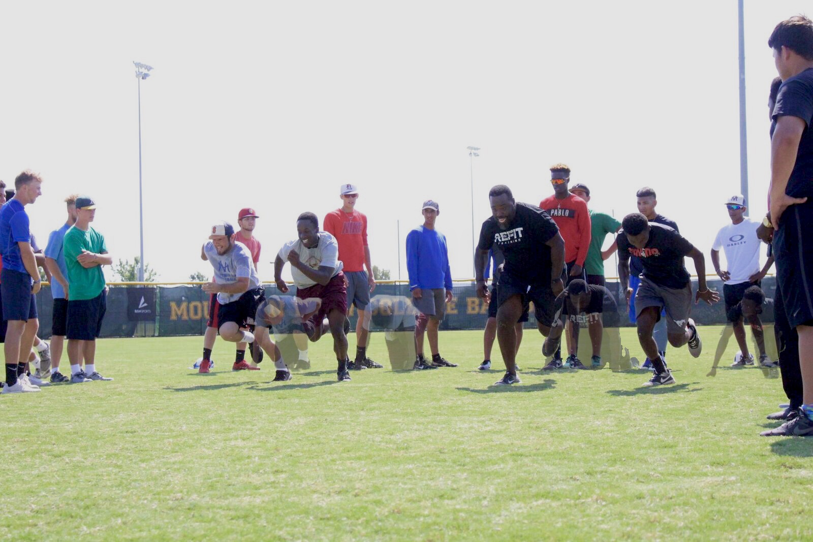 Coach E and the Baseball team working on their get-off.