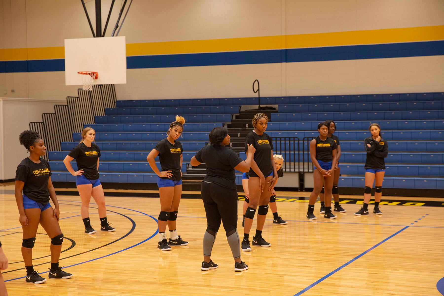 Jana Bonds coaching up our Lady Lions in our home gym.